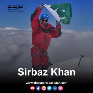 Sirbaz Khan standing triumphantly at the summit of Shishapangma, the first Pakistani to conquer all 14 eight-thousanders, with a breathtaking mountain backdrop